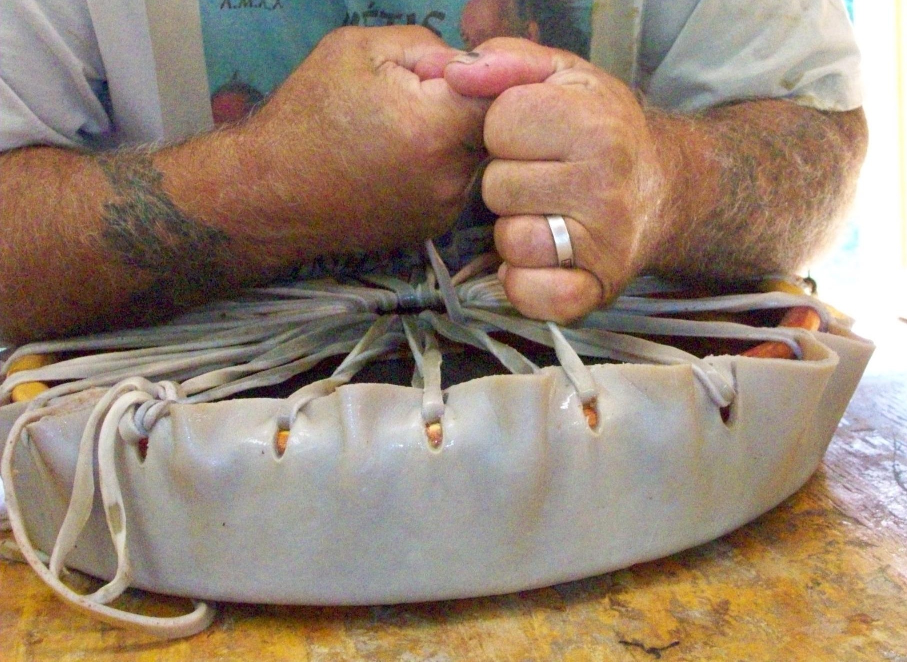 Keith Little Badger tightens Rawhide Heads on Native American Hand Drums